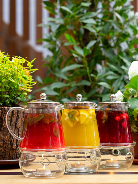 Colorful herbal teas with garnish can dazzle a beverage service!